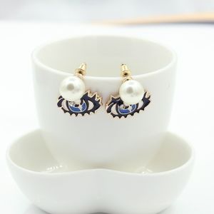 Hanging Pearl Eye Charm Earrings